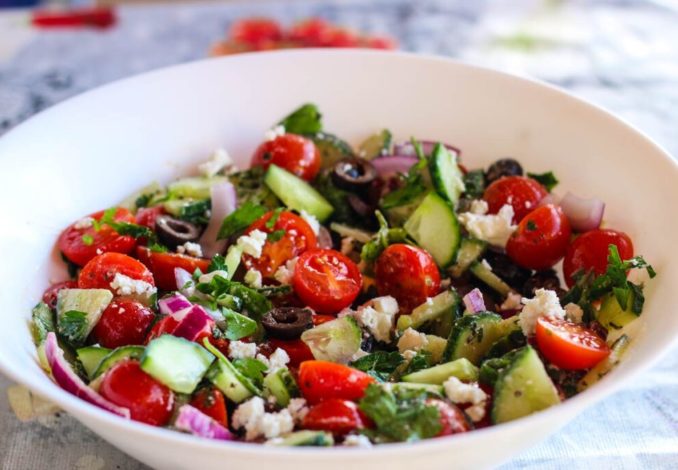 Delicious breakfast salad with olives and cheese, packed with fresh vegetables and a tangy vinaigrette dressing.